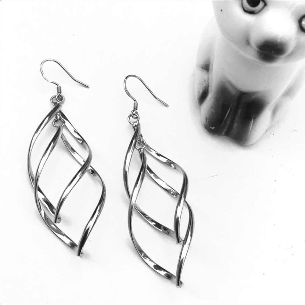 Silver swirling drop earrings EUC